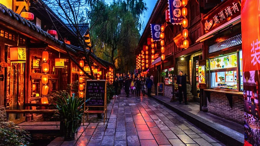 Jinli Ancient Street at night with red lanterns and traditional wooden architecture